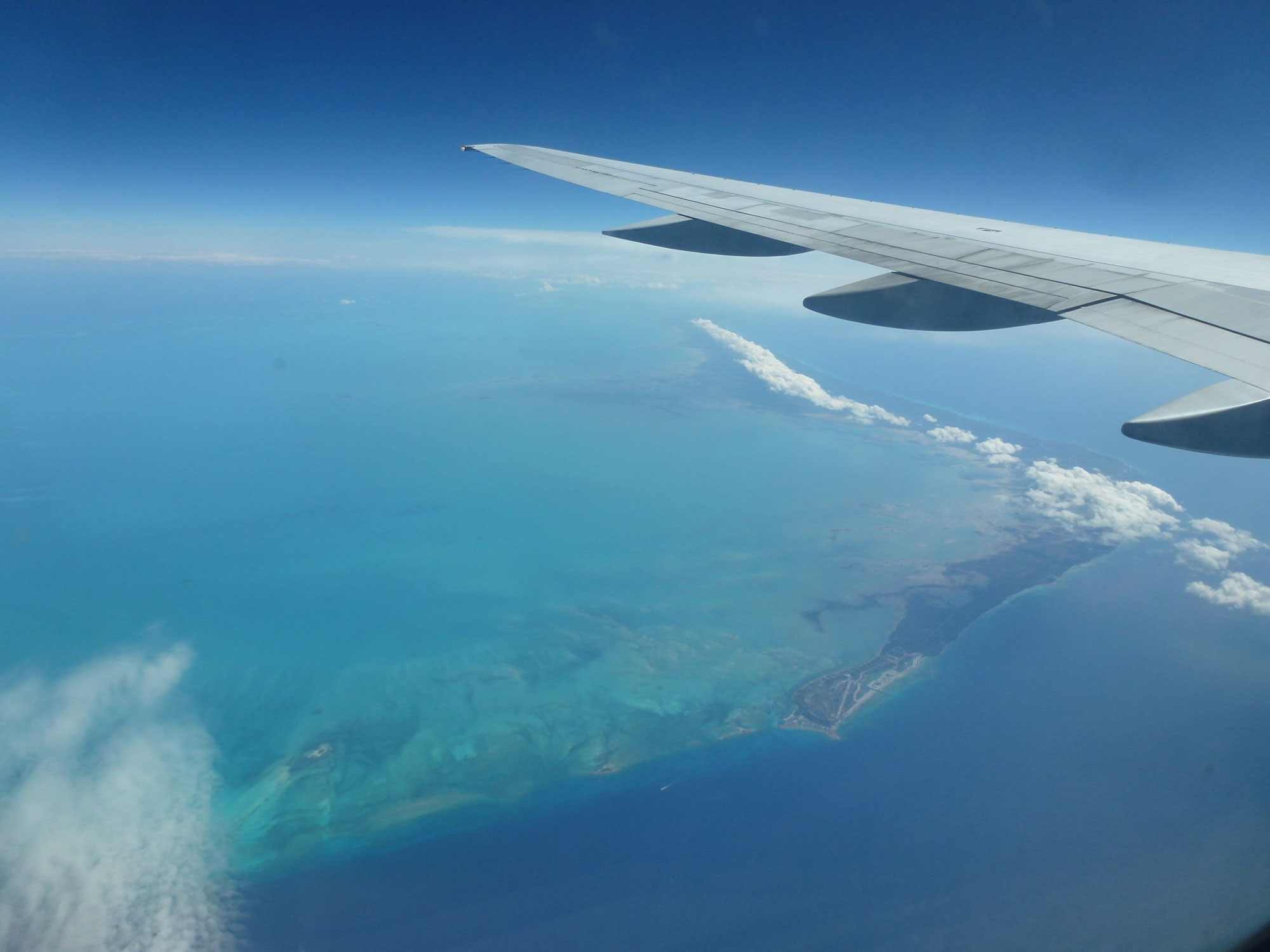 airplane wing over island