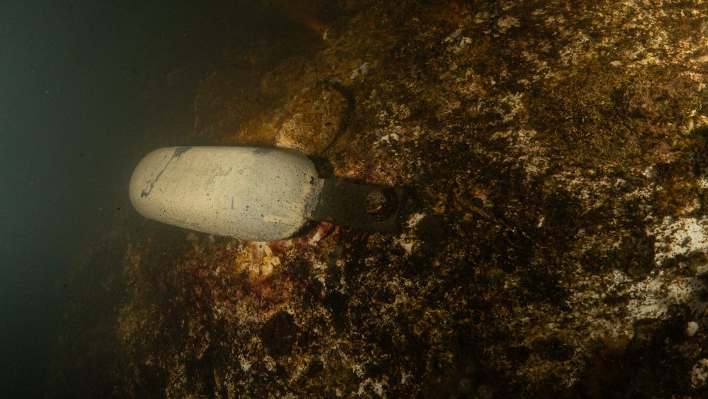 A large weight on the top of the undersea lodge